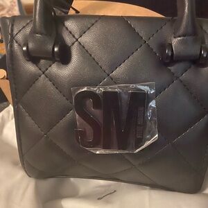Authentic Steve Madden  Crossbody bag mini size with Licious closet dust bag